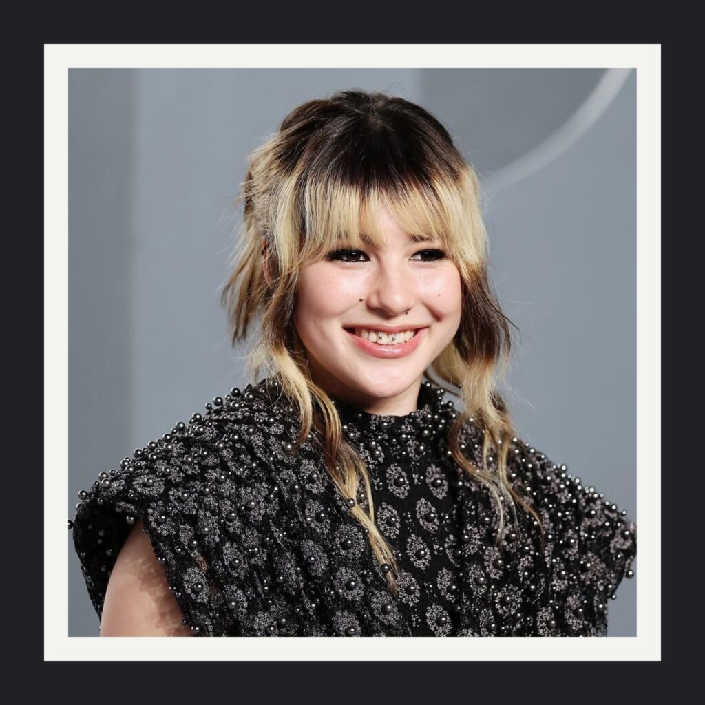 Romantic knot updo created by Anh Co Tran for Alysa Liu at the Vanity Fair Oscars After Party