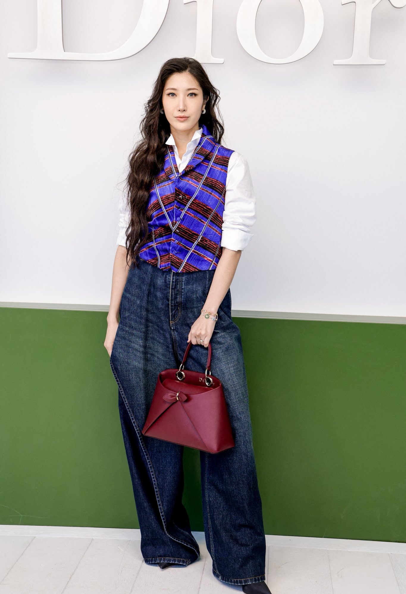 Ejae at Dior Show Paris Fashion Week wearing soft, goddess waves styled by Anh Co Tran.