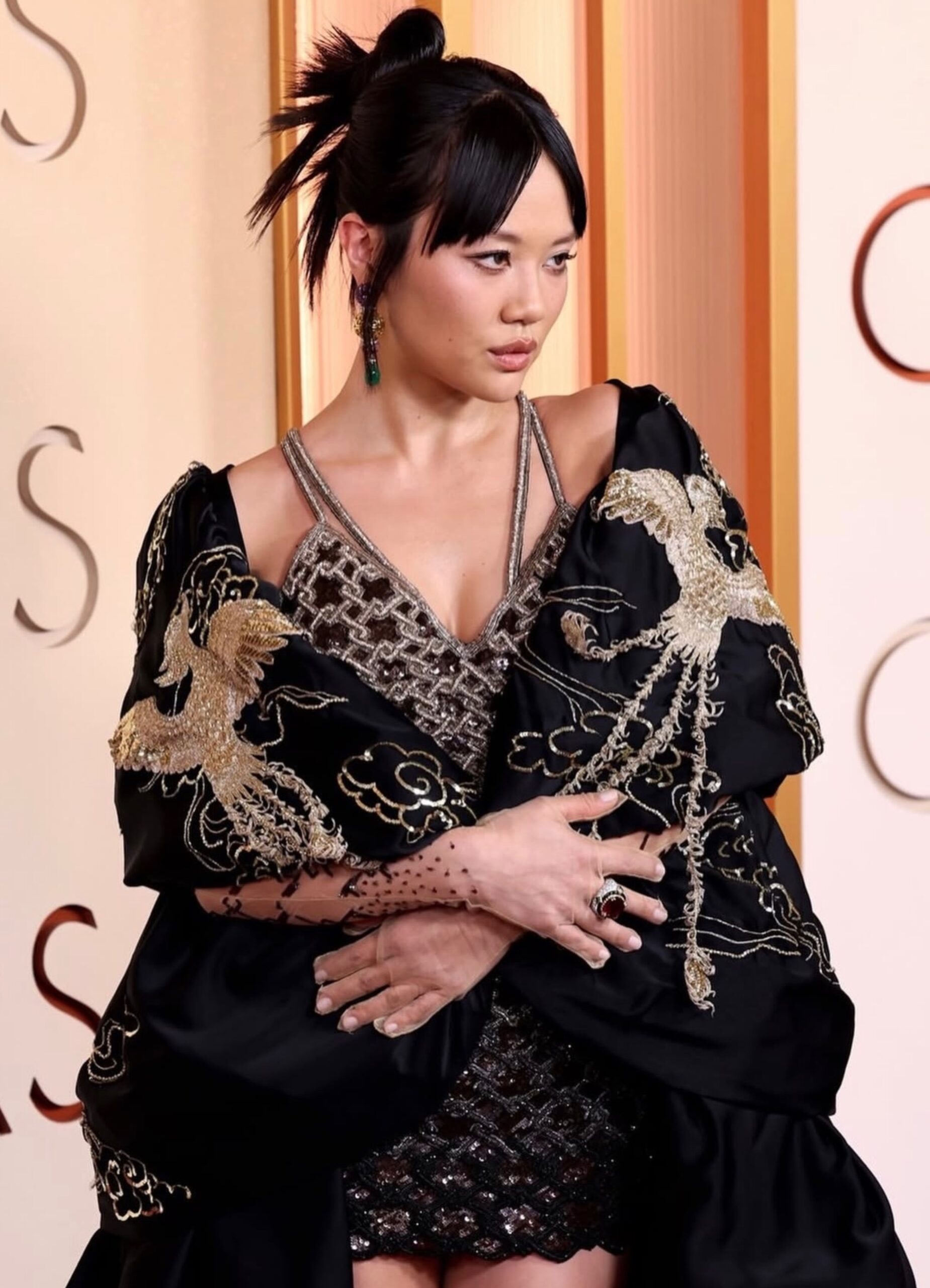 Sculpted bun with fanning details hairstyle by Anh Co Tran for Rei Ami at the 2026 Oscars