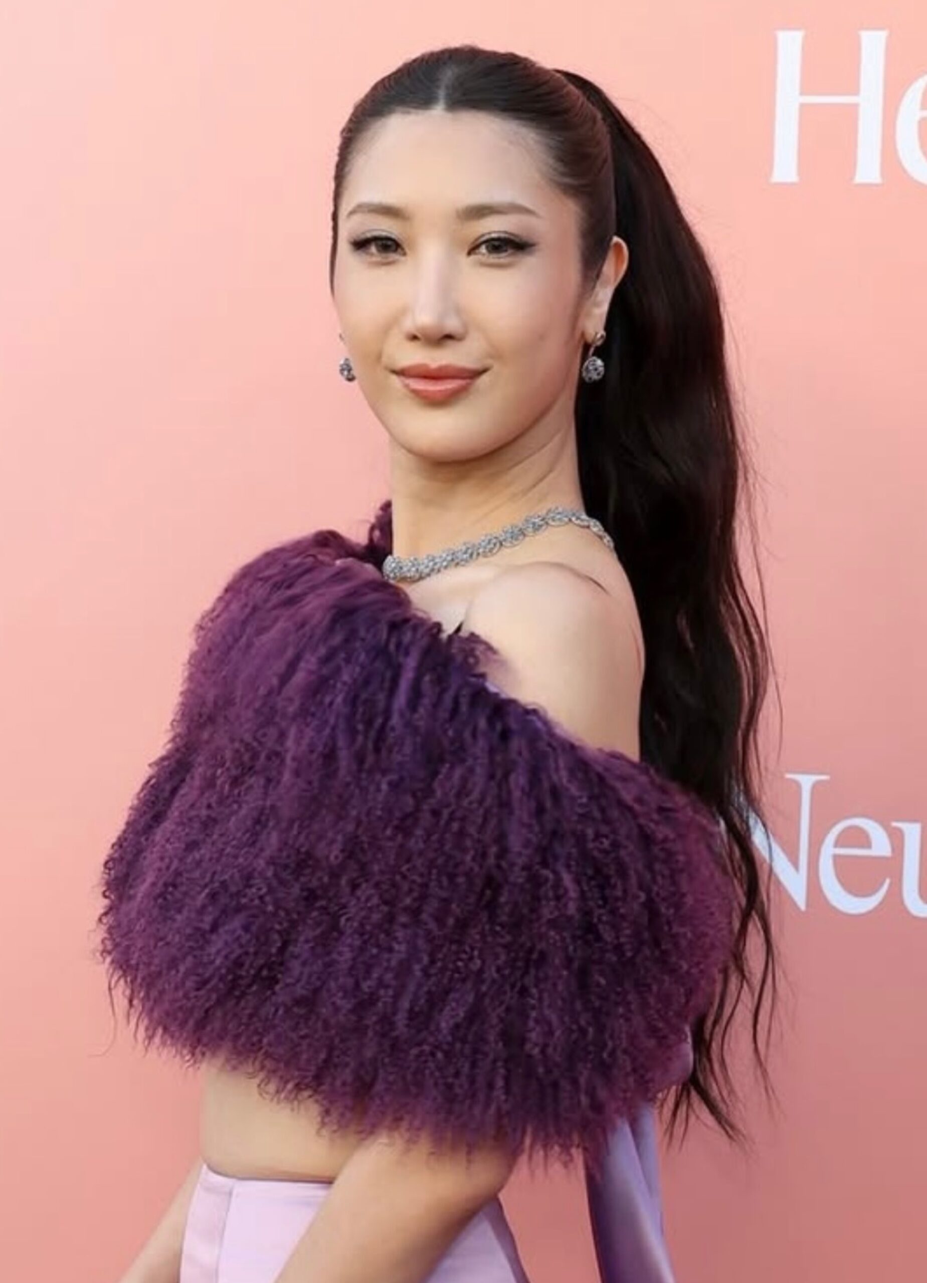 Ejae on the red carpet with a soft wave ponytail styled by Anh Co Tran