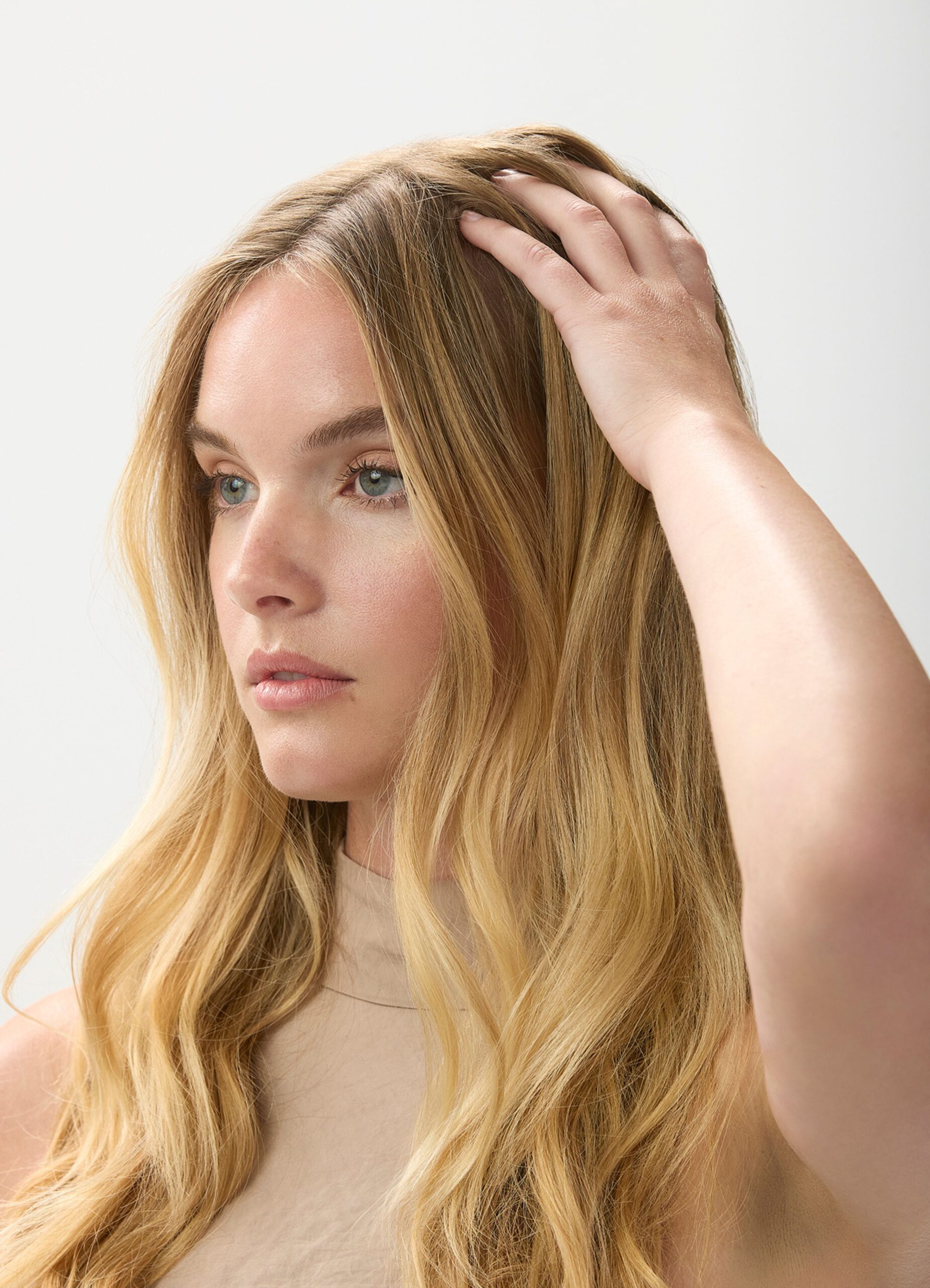 Model Applies Puff Finishing Paste on Roots for Lift
